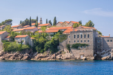 Fototapeta na wymiar Buildings on Sveti Stefan island on Adriatic Sea in Montenegro