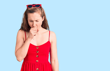 Young beautiful blonde woman wearing casual dress feeling unwell and coughing as symptom for cold...