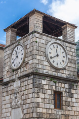 Fototapeta na wymiar 17th century clock tower on the Oruzja main square of Old Town in Kotor, Montenegro