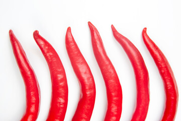 Red hot chili peppers on a white background. food figures. Vitamin vegetable food