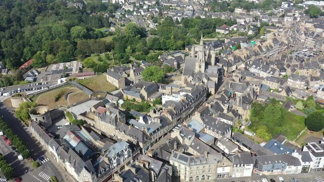 General view of French town of Guingamp in summer looking out over medieval Basilica and walls of ancient fortified chateau, Brittany
