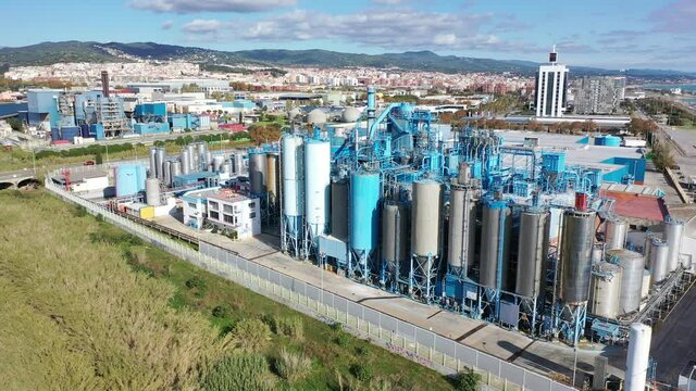 Aerial view of industrial facilities of Mataro factory producing detergent and air fresheners, Costa del Maresme, Spain