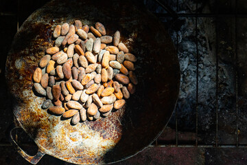 Roast cocoa  beans in a "comal", a traditional pan used in latin america kitchens.