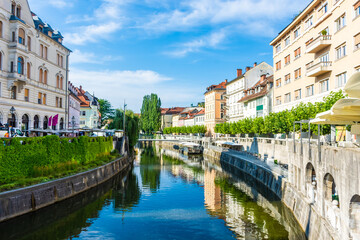 Fototapeta na wymiar LJUBLJANA, SLOVENIA, 5th AUGUST 2019: The river flowing in the historic center