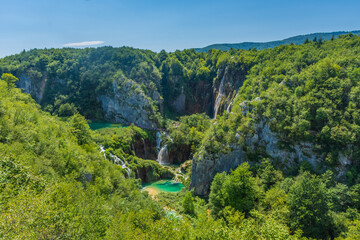 Fototapeta na wymiar Little colorful lake and beautiful waterfalls in Plitvice Lakes National Park, Croatia