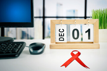 Calendar of December with date of 01 on office desk