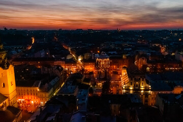 View on illuminated Latin cathedral and historic center of the Lviv at sunset. View on Lvov cityscape from the town hall
