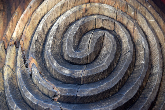 Close up detail of a carved wooden koru pattern