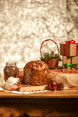 Chocolate panettone  on wooden table with christmas ornaments