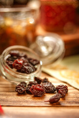Some raisins on wooden table