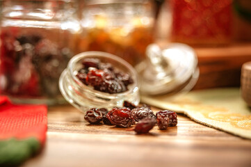 Some raisins on wooden table