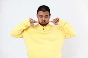 Asia man making a funny face on white background