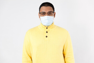 A man wearing protective mask wearing a yellow shirt, white background