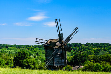 Plakat Old wooden wind mill in Pyrohiv, Ukraine