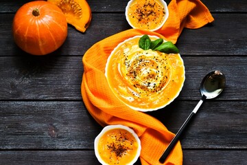pasta with pumpkin on a wooden background. Pumpkin soup.
