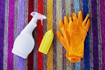 Simple home tidying kit. Gloves, brush, cleaning agent.