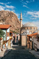 Fototapeta na wymiar Street with traditional turkish ottoman houses in Afyonkarahisar city, Turkey