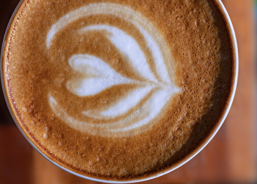 Hot Latte Coffee Art Hart Shape On A Table.