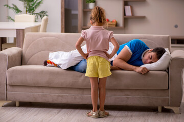 Young man with his daughter at home