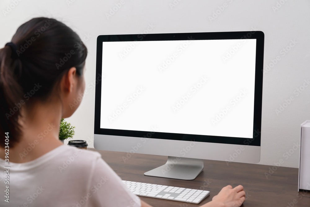 Fototapete Business woman hand using computer and type on the keyboard. Mockup screen of advertisement.