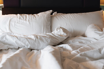 Soft pillows and duvet, on bed. Cozy bedroom