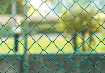 Fototapeta premium Green fence net steel
