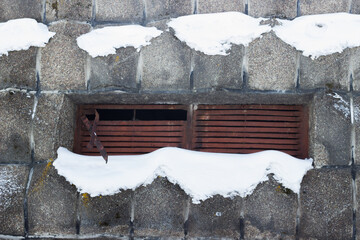 Ventilation windows in the transformer bottle. Snow on the embossed wall.