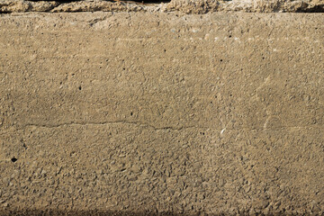 Concrete block. Yellow concrete texture. Unusual background.