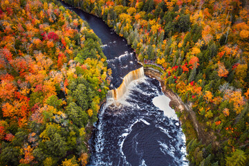Incredible aerial photograph of the upper waterfall cascade at Tahquamenon Falls with beautiful...