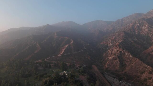 Aerial shot of drone flying towards San Fernando Mountains in Sylmar, California. 4K dolly in