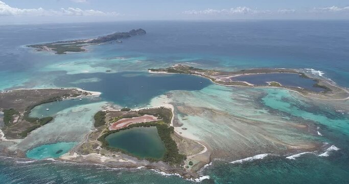 Aerial View pan rigth Caribbean sea in  Francisky Los roques  Venezuela  tild up  movement