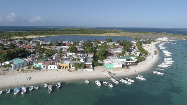 Gran Roque Island  los roques venezuela  Aerial Shot Forward,  drone aerial view , over Exotic Island Beach With Fishermen Boats.
