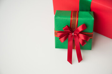 Gift box mockup on the white table with copy space. Merry christmas and happy new years background for text advertise.