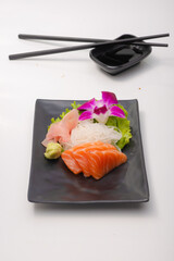 fine sliced salmon prepare on black plate