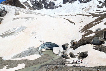 Rope teams training crevasse rescue and mountaineering on glacier Taschachferner and mountain snow...