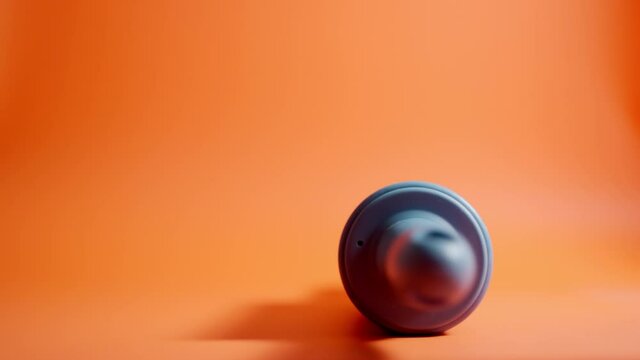 Rolling pin rolls from left to right. Orange background.