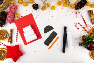 DIY step-by-step instructions for a Christmas card with children. Volumetric snowman on a postcard...