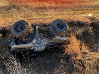 A flipped over ATV