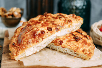 Close-up of a traditional Greek pie made from handmade puff pastry and filled with goat's cheese and feta cheese.