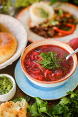 Chickpea soup. Moroccan traditional dish. Wooden background. Close up.
