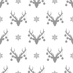 seamless winter pattern with grey snowflakes and deer heads with antlers and christmas tree toy balls on horns.