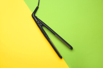 Straightening iron on color background