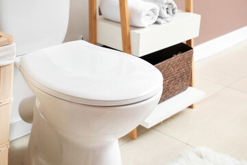 Toilet bowl in modern bathroom