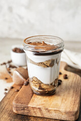 Sweet tasty tiramisu on table