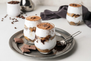 Sweet tasty tiramisu on table