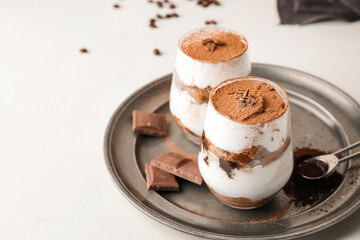 Sweet tasty tiramisu on table