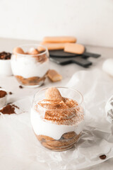 Sweet tasty tiramisu on table