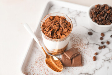 Sweet tasty tiramisu on table