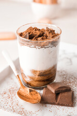 Sweet tasty tiramisu on table