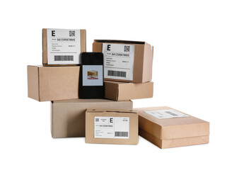 Mobile phone with open page of delivery service application and parcels on white background